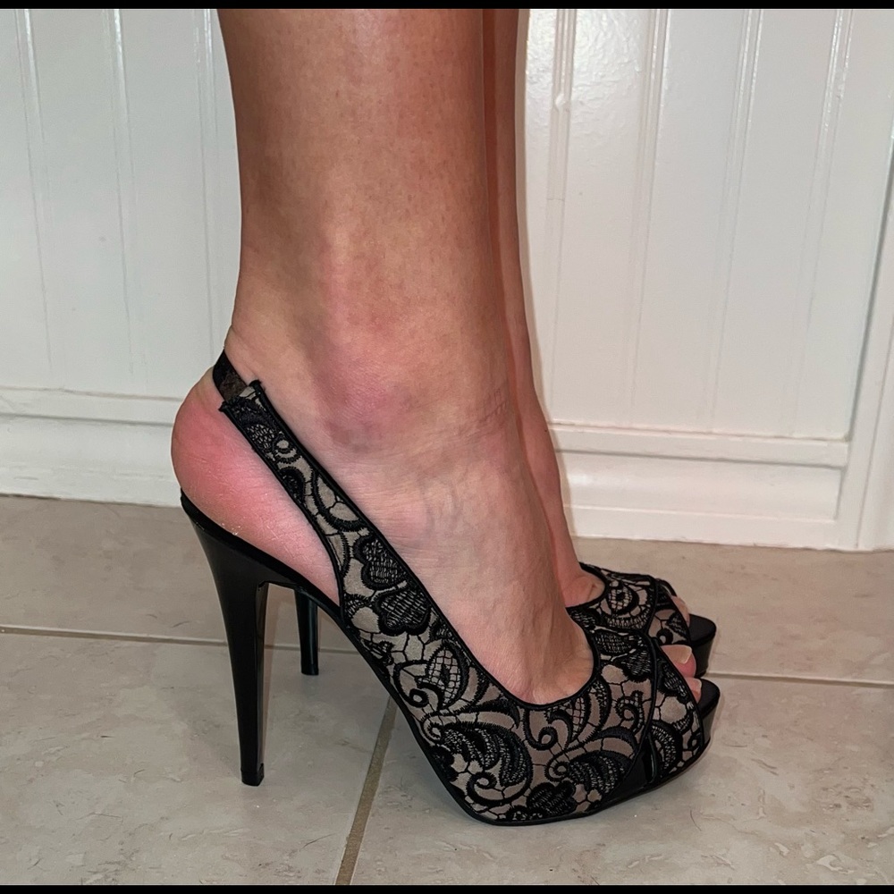 Black lace heels by Guess